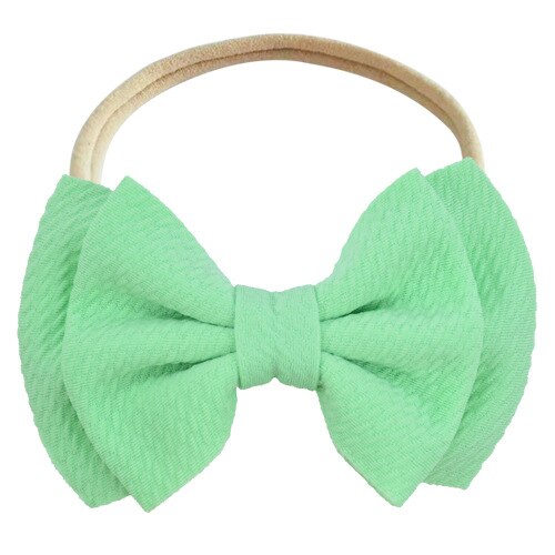 Stylish baby girls' white elastic bow headband, perfect for special occasions.