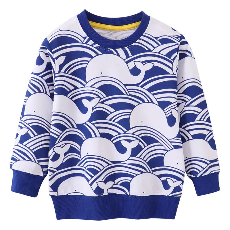 Close-up of the whale print on a girls' long sleeve cotton dress, showcasing the cute design