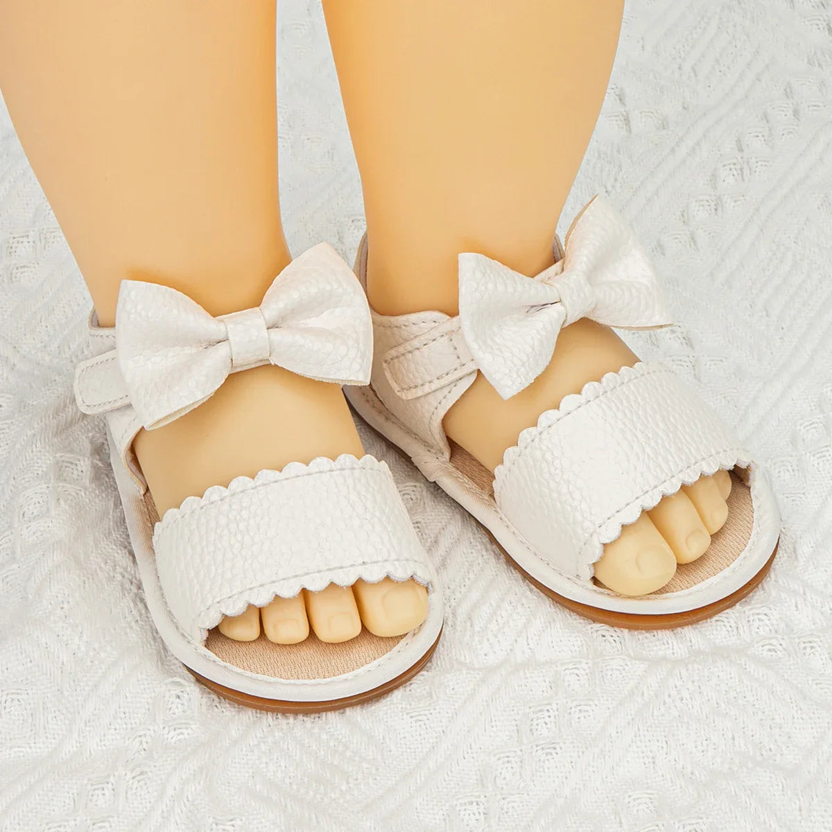 Stylish pink PU leather baby sandals with a cute bowknot, essential summer footwear