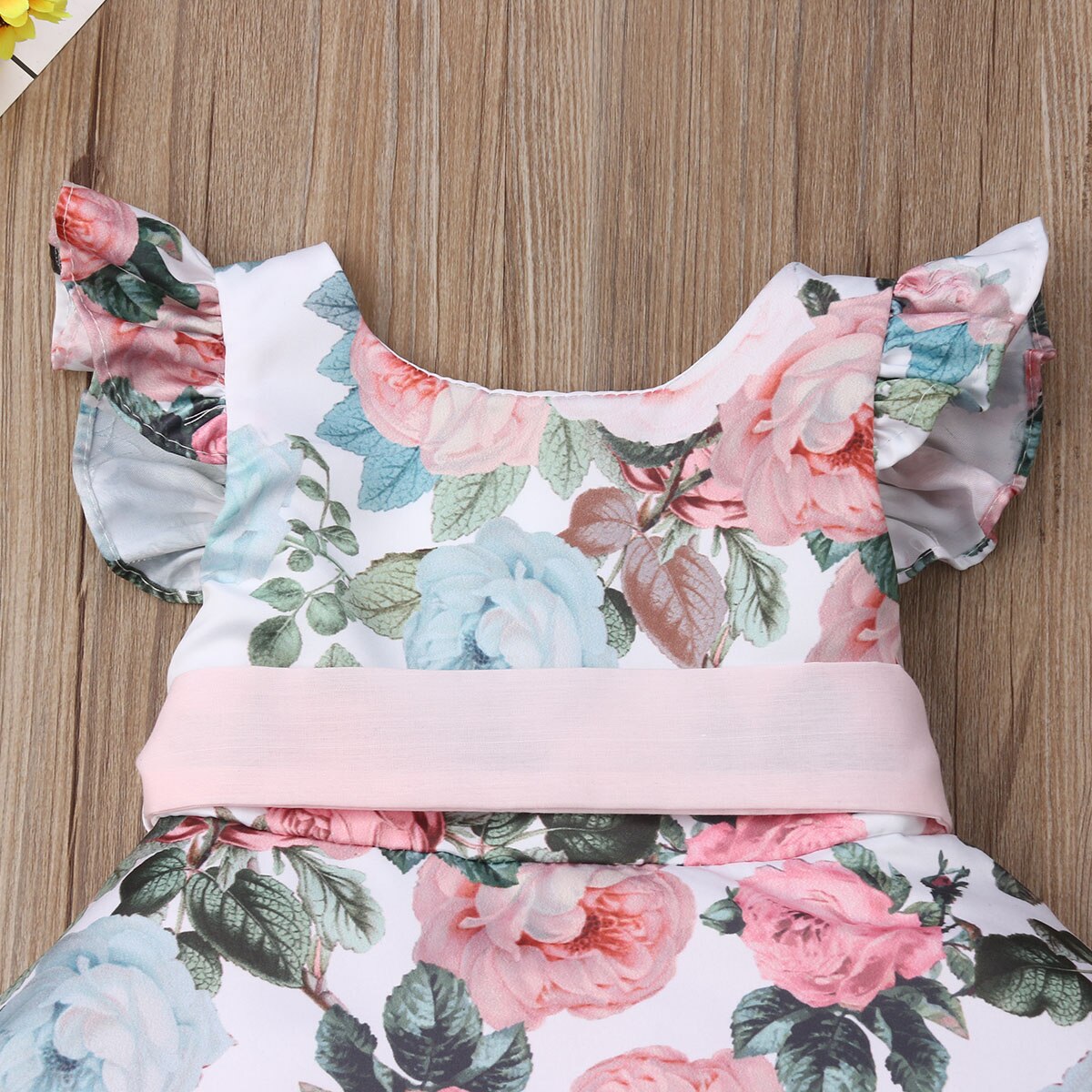 Pink floral girls' tutu dress with batwing sleeves, a charming and comfortable special occasion outfit.