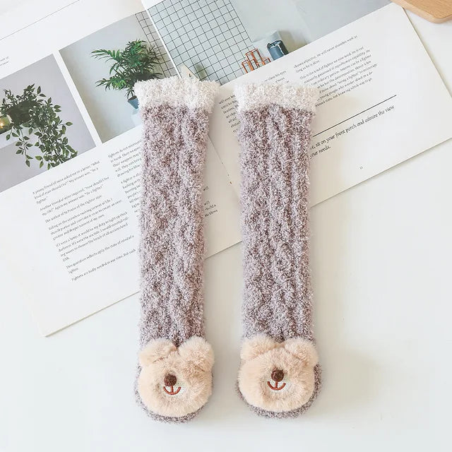 Assorted pack of animal and fruit leg warmers for babies, featuring soft, warm cotton