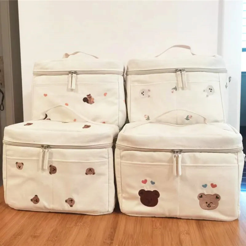 Mom's essential: insulated baby bottle stroller bag, keeps drinks cool for hours.
