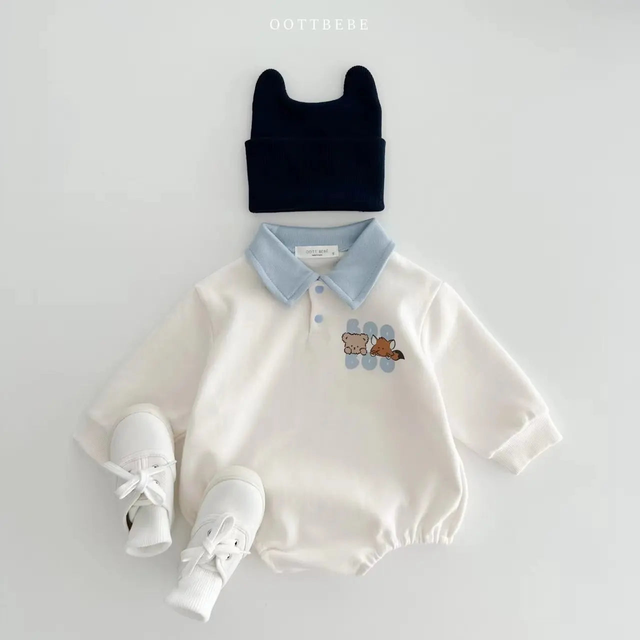 Essential baby boy long sleeve cotton romper, durable and machine-washable with a fun cartoon.