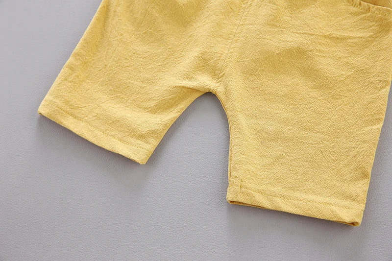 Graphic print baby clothing: short sleeve top and shorts with playful pyramid motif