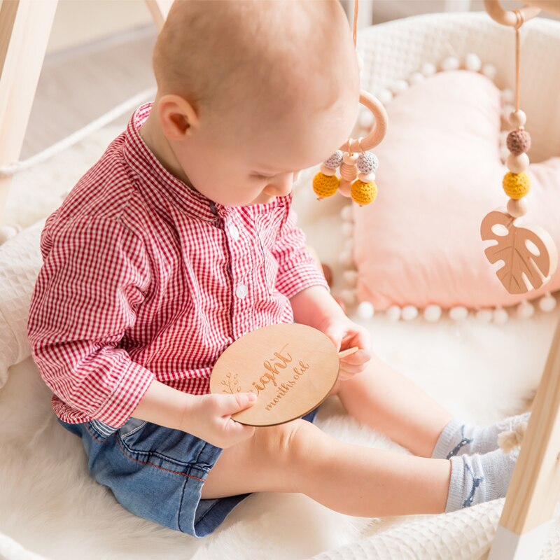 Collection of baby monthly milestone wooden cards, essential baby photo props for capturing growth