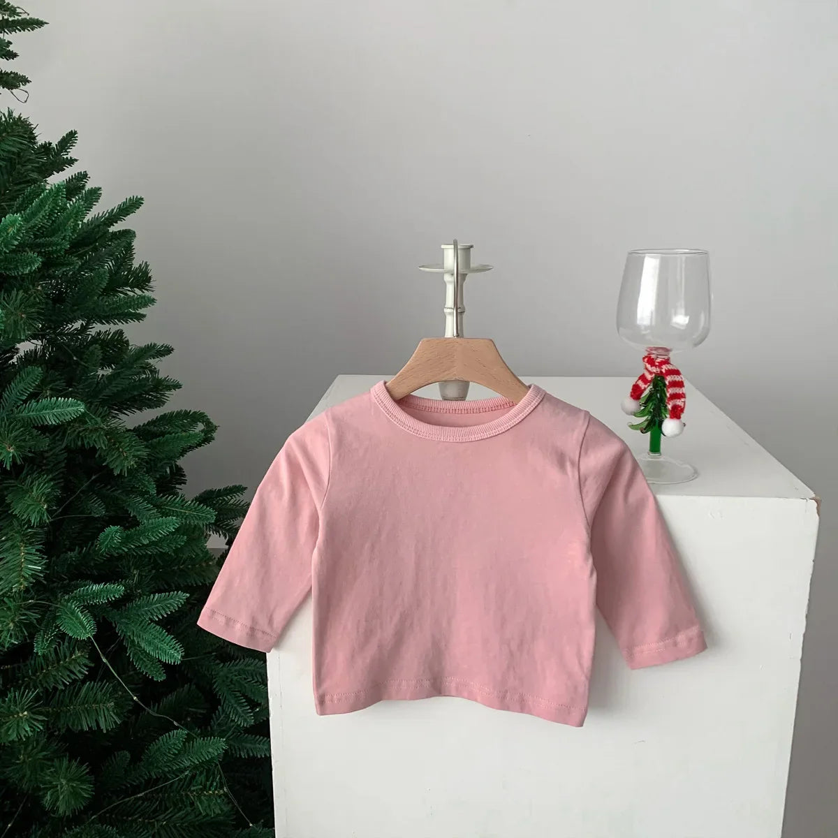 Soft plain cream cotton tee, short sleeve, versatile unisex baby clothing for all seasons.
