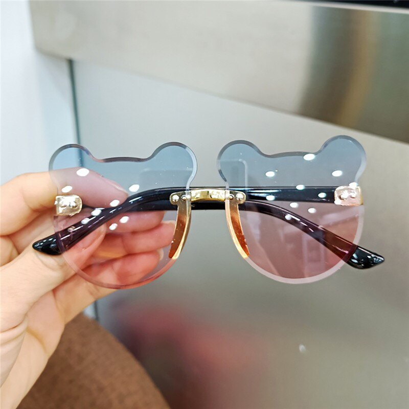 Assorted kids cartoon sunglasses with UV protection, showcasing various playful designs