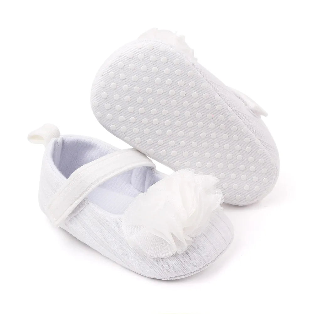Stylish floral cotton soft sole baby shoes for girls, providing gentle support for little feet.