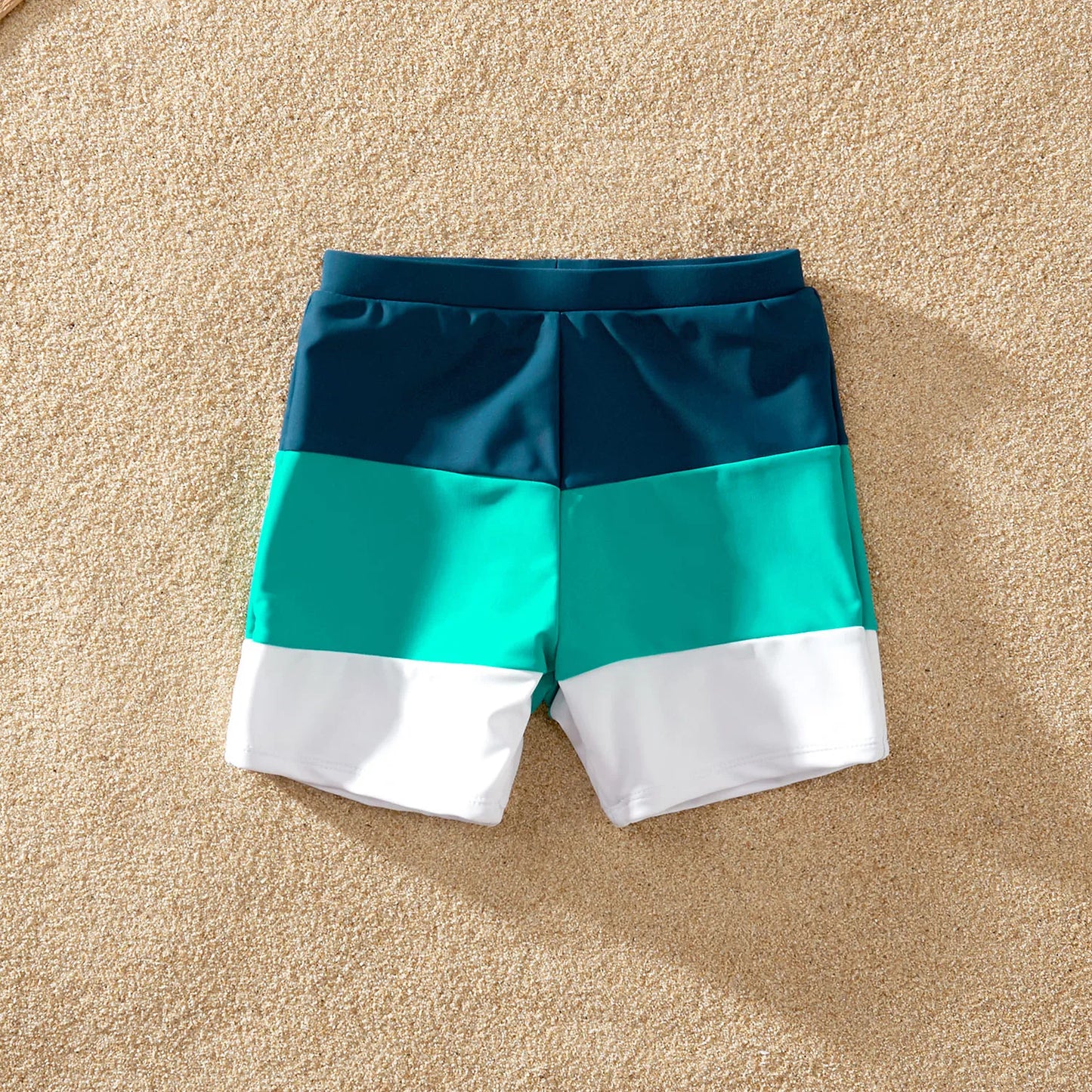Back view of a child's color block swimsuit, showcasing the fun and vibrant design for summer