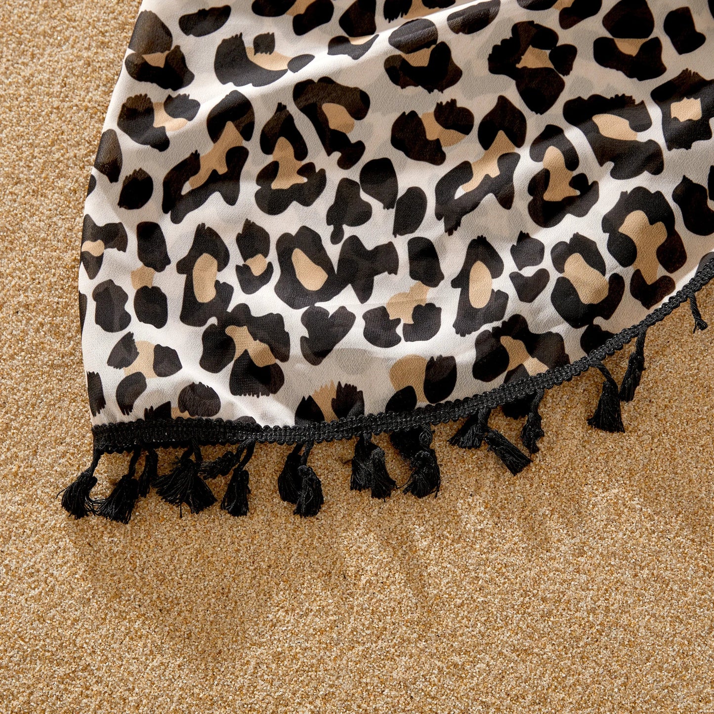 Coordinated leopard print family outfits, perfect for seaside relaxation