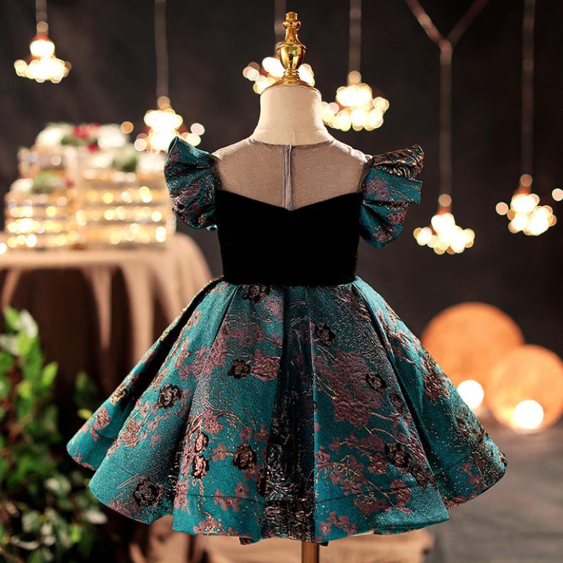 Little girl modeling a pink butterfly sleeve princess ball gown, 'retro' kids' special occasion dress