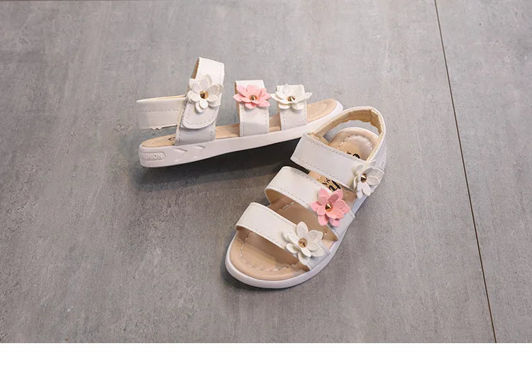 Kids' summer gladiator sandals with vibrant floral accents and a soft footbed