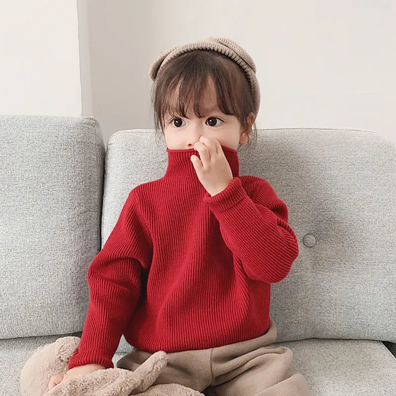 Girls' knitted turtleneck sweater, displaying the excellent craftsmanship and cozy texture for cold days