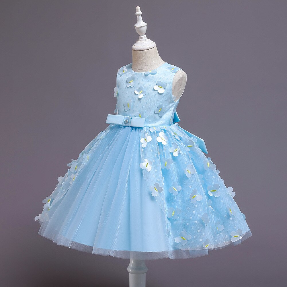 Girls' party dress with a heavily embellished top of pearls and sequins, full skirt, formal look