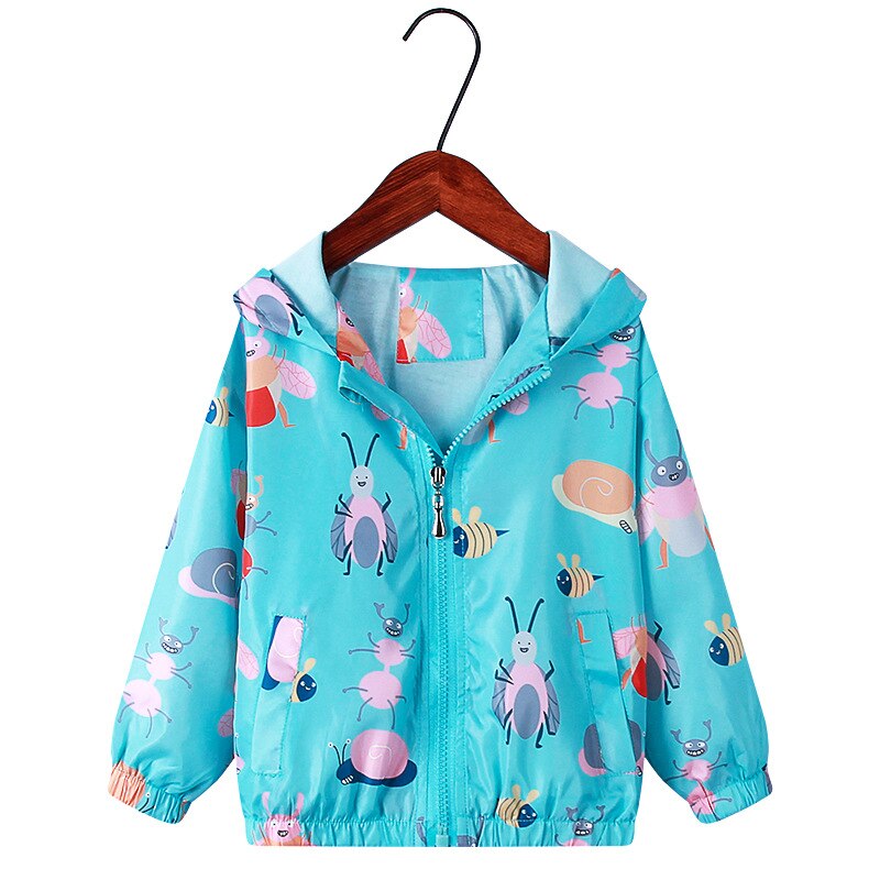 Close-up of the hood on a girls' rainbow unicorn windbreaker jacket, practical kids outerwear