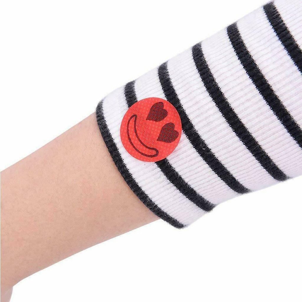 Family enjoying picnic outdoors, all wearing Natural Mosquito Repellent Patches for pest control