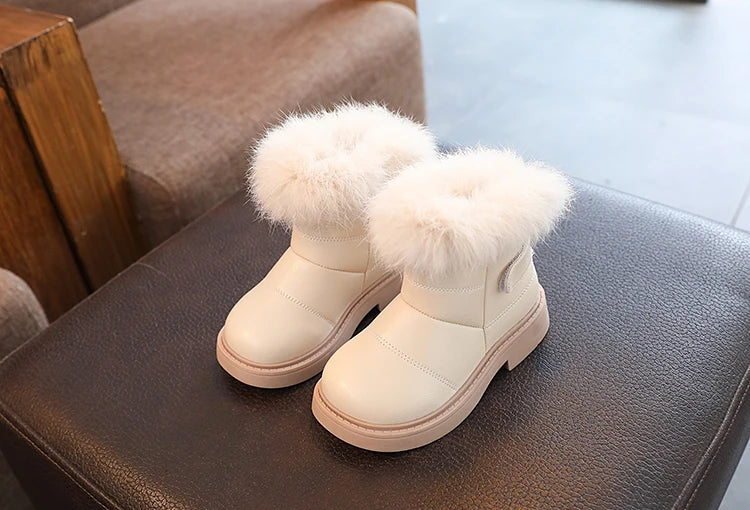 Warm blue snow boots for kids, ensuring dry and cozy feet during winter fun