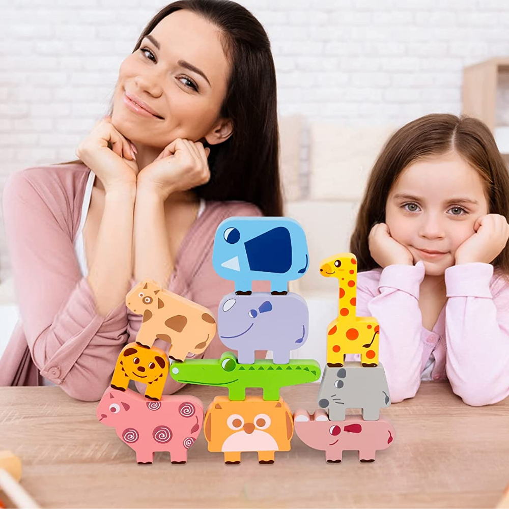 Preschooler engaging with wooden stacking animals, a fun educational fine motor skill game