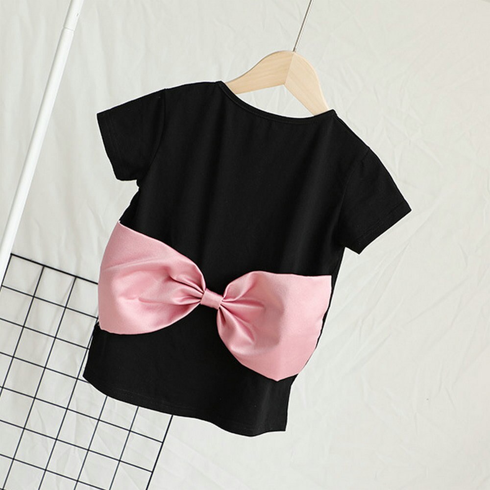 Stylish mommy and me pink dresses featuring a prominent bow, designed for comfortable summer wear.