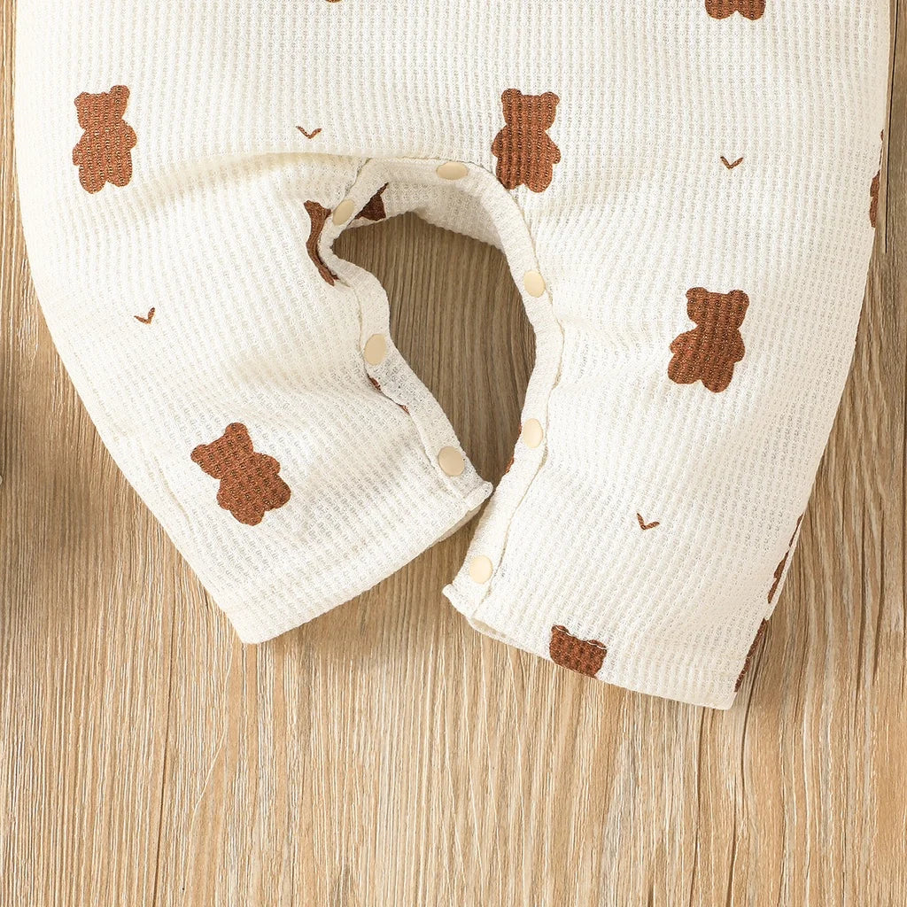 High-quality cotton romper with long sleeves and bear graphic, perfect unisex newborn outfit