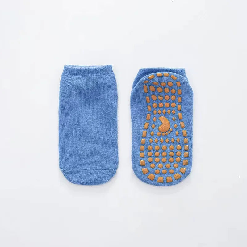 Set of anti-slip trampoline socks in different sizes, from baby to adult.