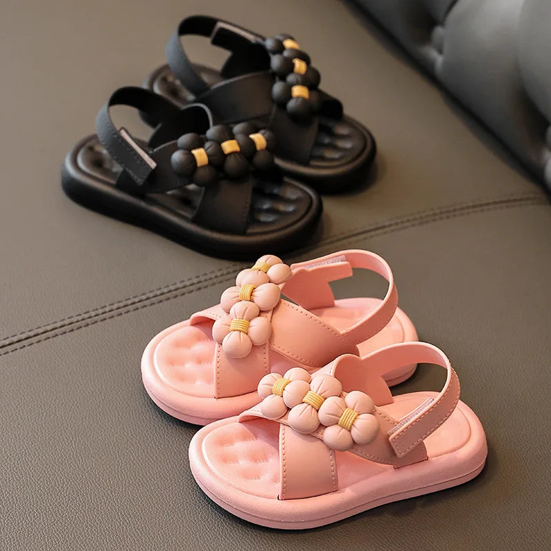 Collection of girls' platform sandals in pink, black, and white with flower embellishments, versatile kids' shoes.