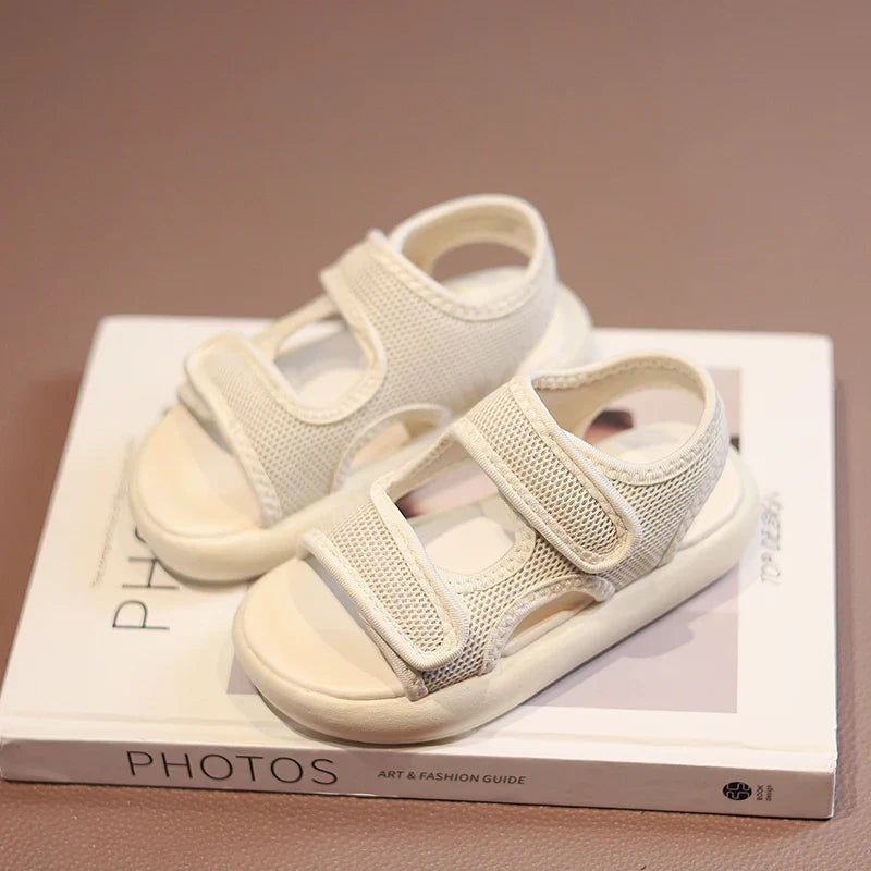 Stylish purple toddler sandals, offering breathable comfort and easy wear for summer outdoor play.