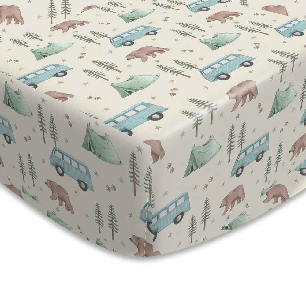 Cartoon print baby crib sheet, perfect newborn essential, soft cotton for peaceful sleep.