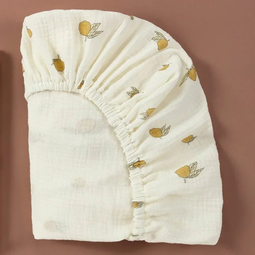 White cotton gauze bassinet sheet, close-up texture, perfect for sensitive baby skin