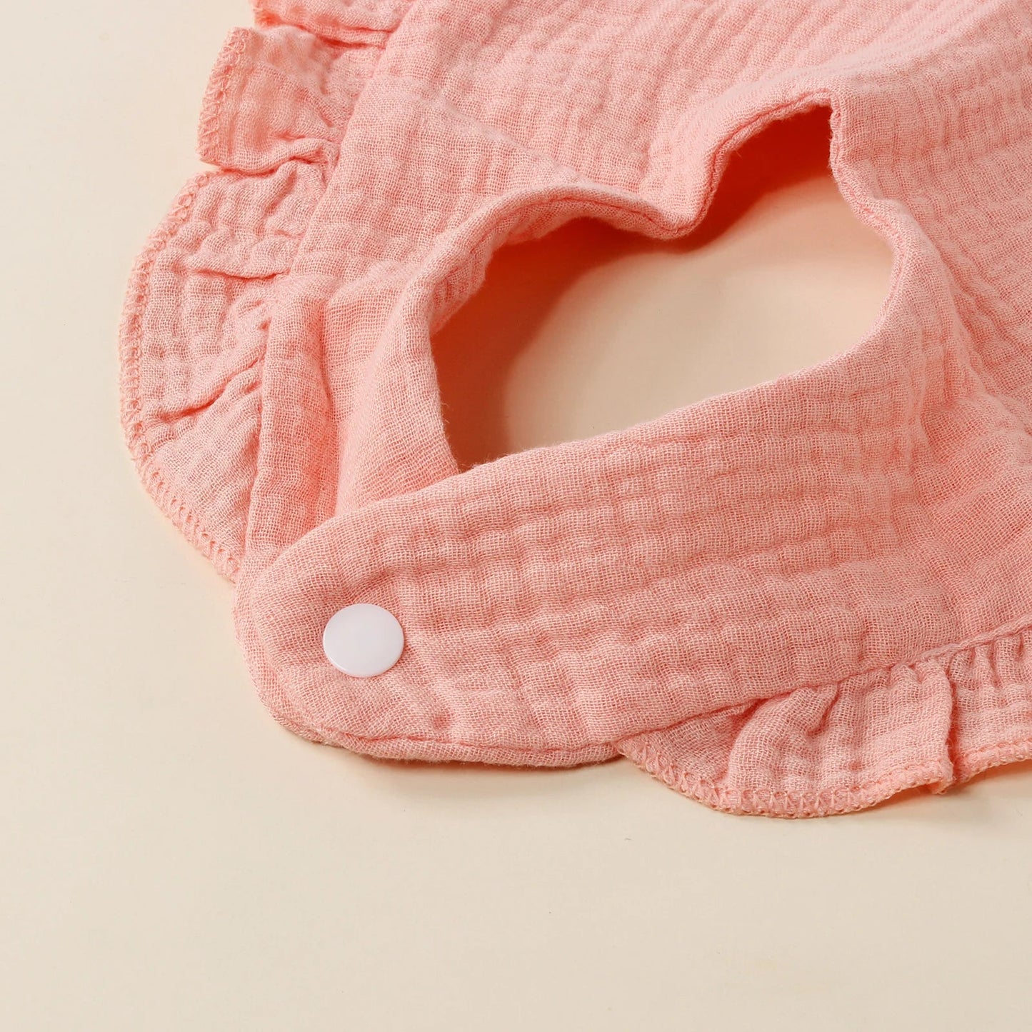 Durable cotton feeding bib for active toddlers, stain-resistant and soft, essential baby accessory.