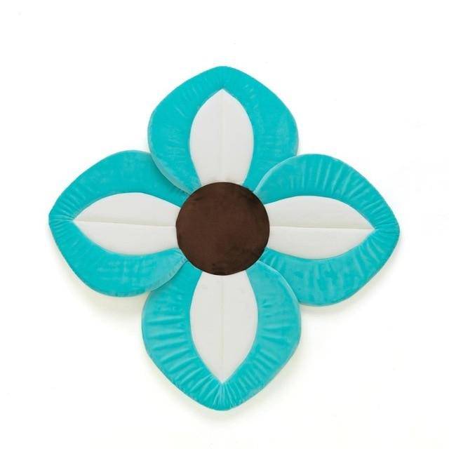 Assortment of colorful lotus baby bath pads, essential newborn bathing accessories for sink bathtubs.