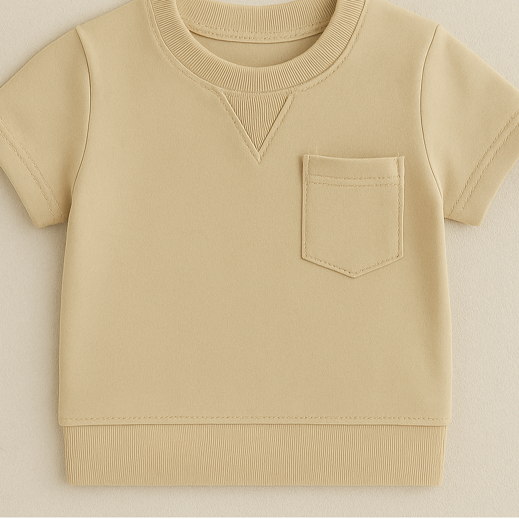 Close-up of soft cotton fabric on a toddler boys' summer outfit, great for comfort and play.