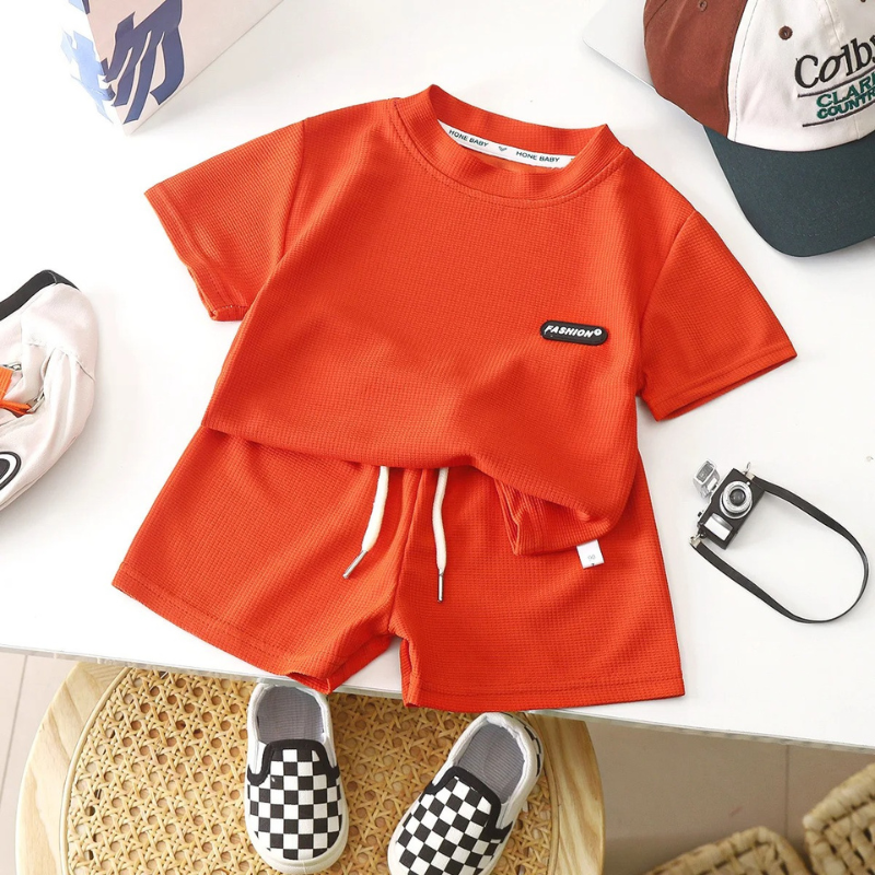 Collection of boys' soft cotton summer outfits in various colors for casual wear
