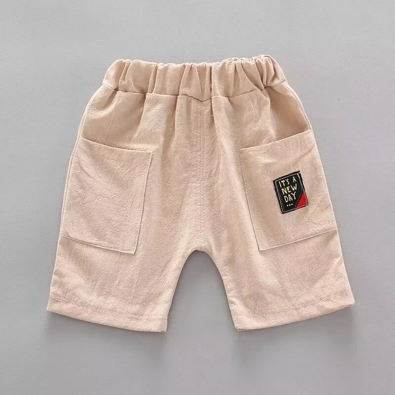 Durable toddler boys' summer clothes, cotton printed top and shorts, perfect for active play and summer.