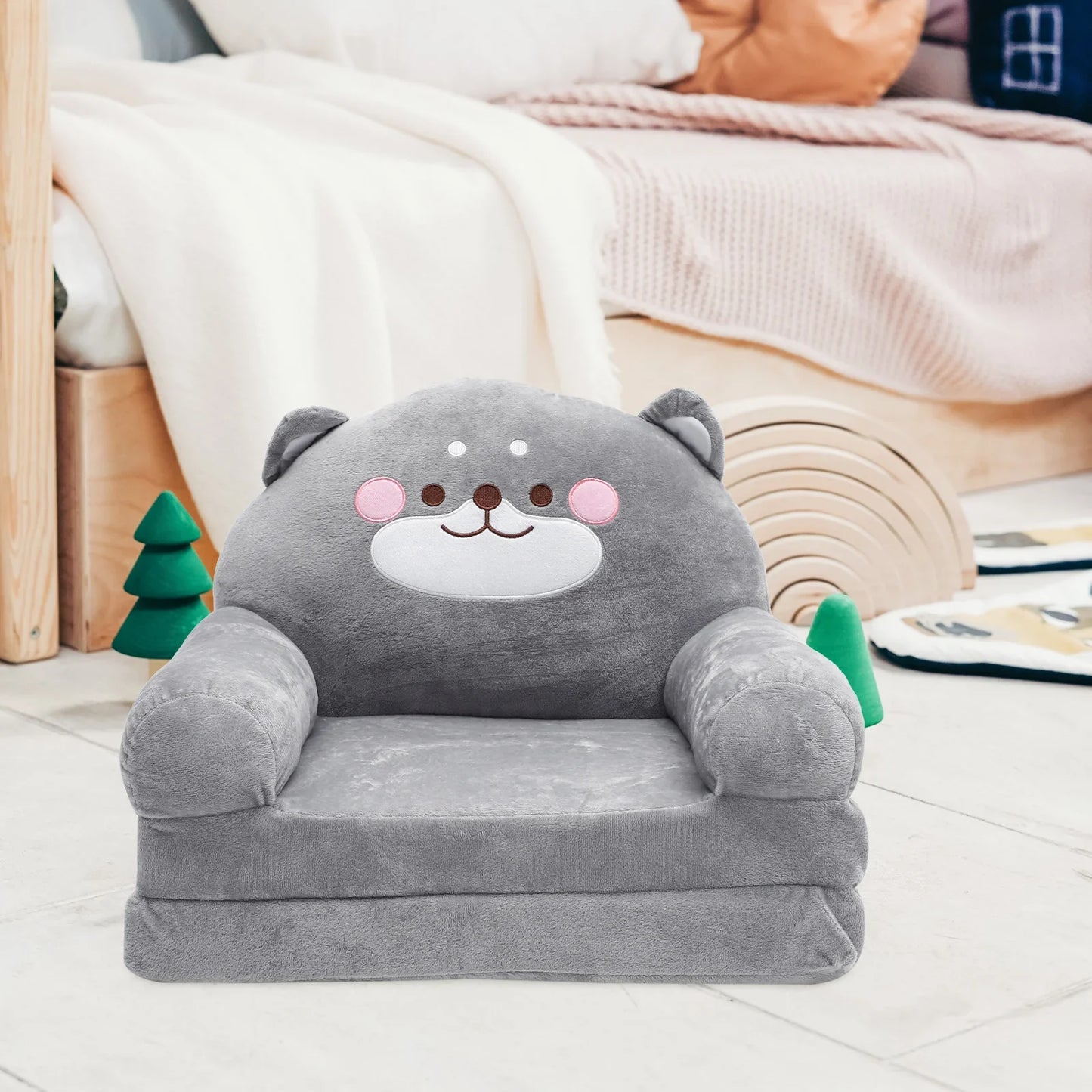 Nursery elephant plush armchair, a foldable toddler seat for comfy and cute playroom decor.
