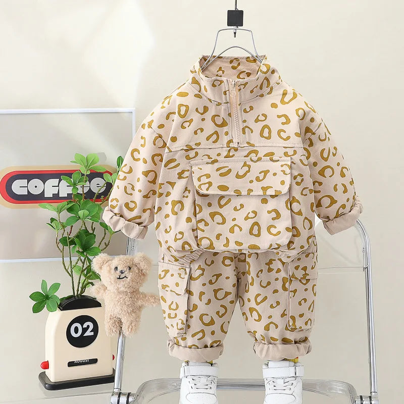 Detailed image of the elastic waistband on the leopard print pants, part of a kids' two-piece set.