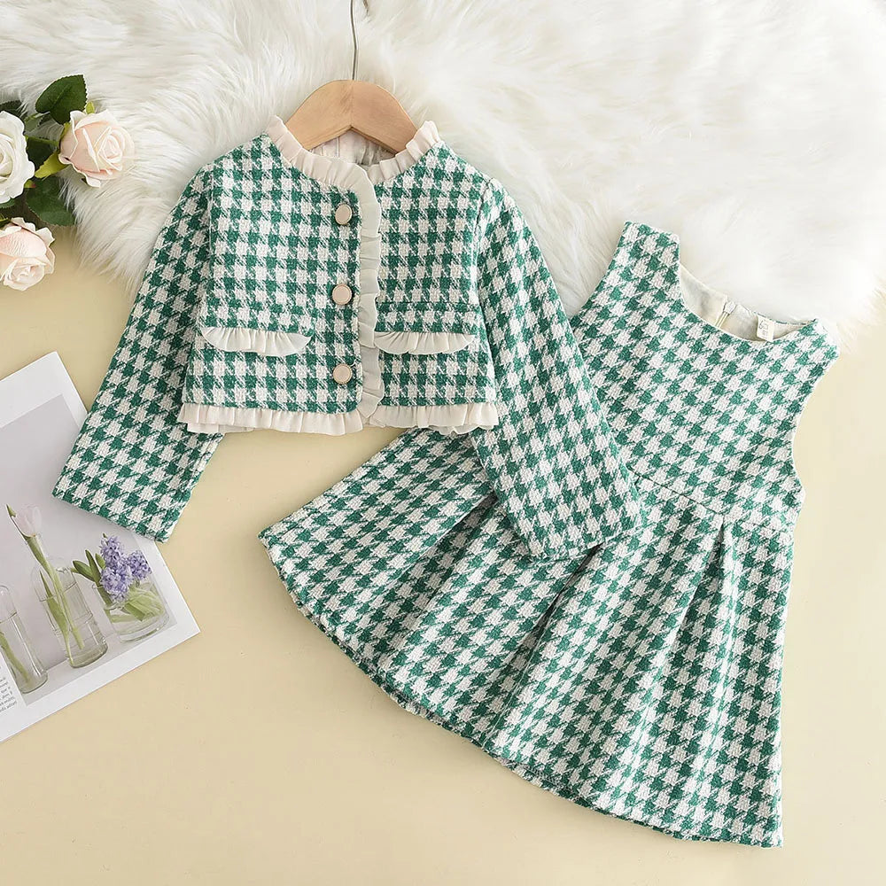 Girls' cozy checkered pattern pants from a two-piece outfit, showing soft acrylic texture and fit