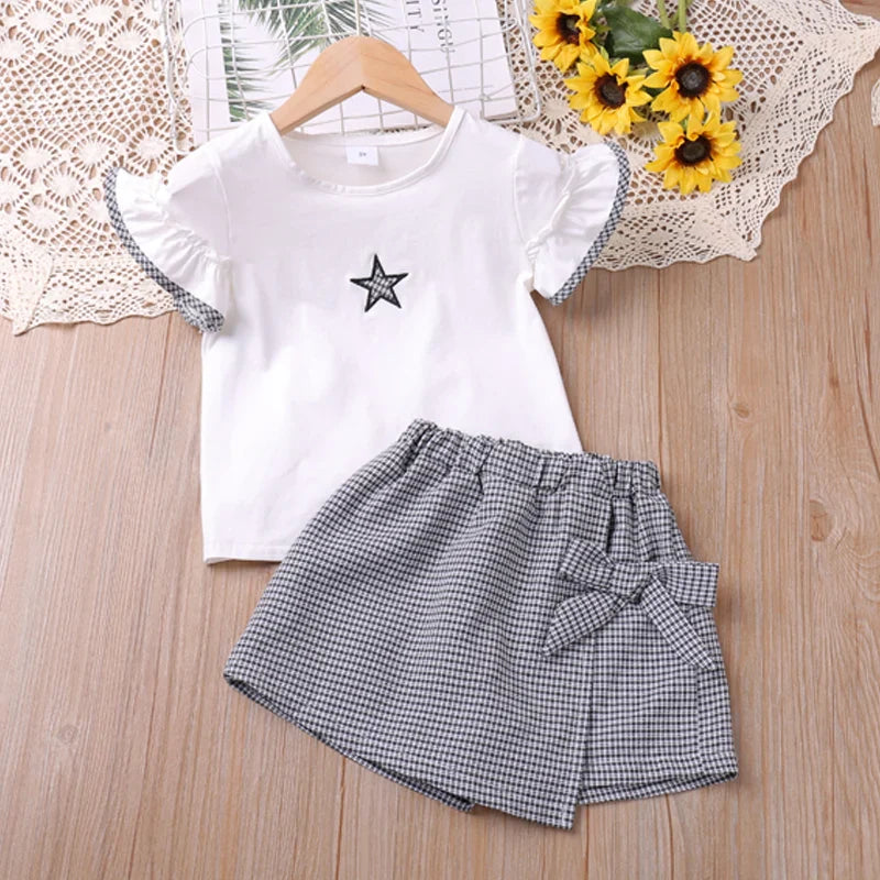 Girls' star print cotton lycra short-sleeve top and shorts set for toddlers, great for warm weather.
