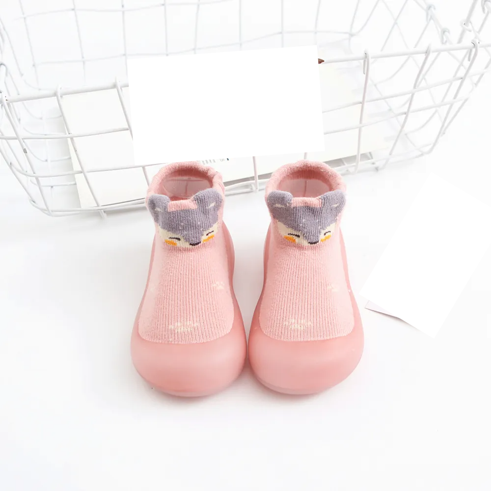 Stylish anti-slip baby socks, neutral colors with effective rubber soles for infant mobility.