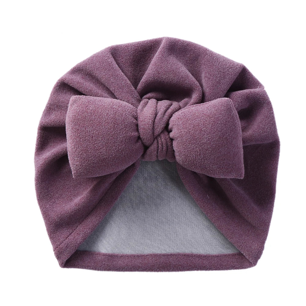 Unisex infant accessory: Cashmere-like bow topknot bonnet, designed for warmth and style