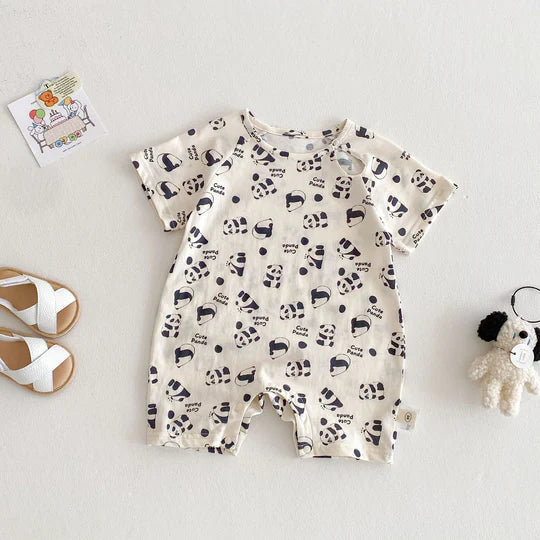 Three unisex baby rompers in various playful designs, essential for comfortable baby wear.