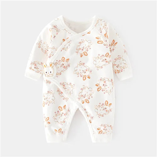 Group of assorted unisex cotton newborn rompers with various soft prints, baby clothing collection