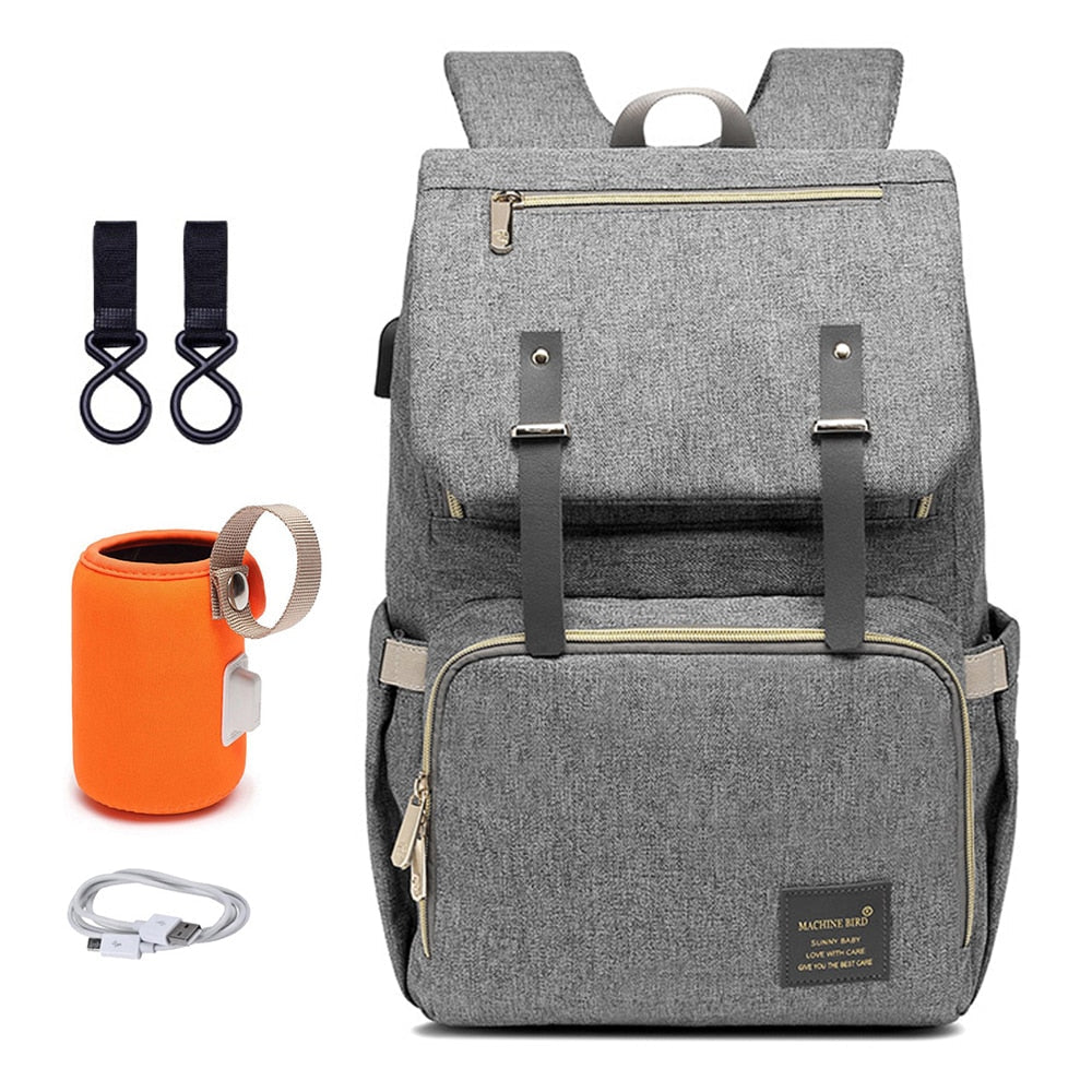 Insulated side pocket of a unisex diaper backpack, keeping baby bottles warm for parenting essentials.