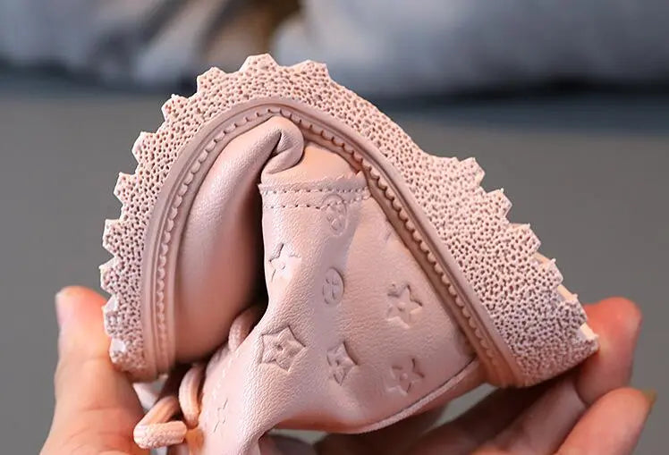 Kids' winter boots featuring plush lining and robust laces, essential for cold weather