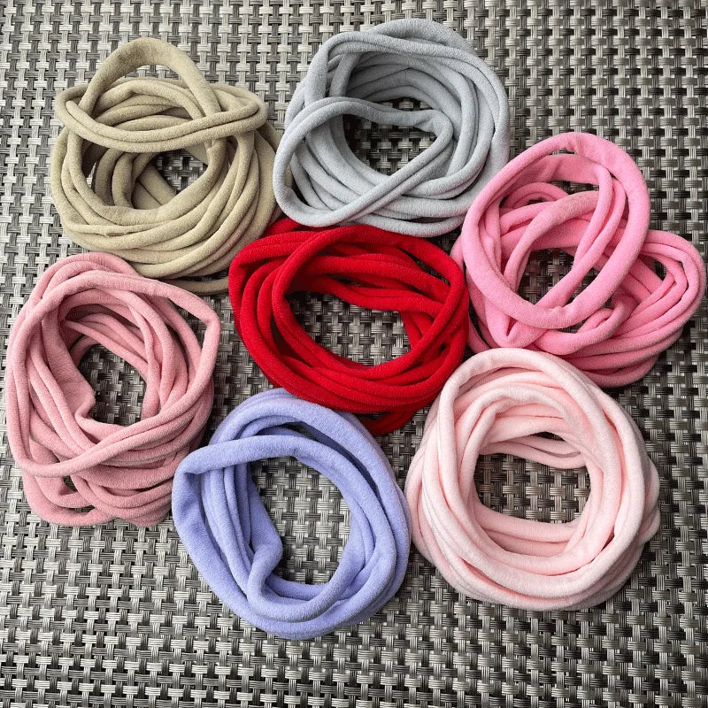 Close-up of a pink soft nylon headband, perfect for girls' hair accessories