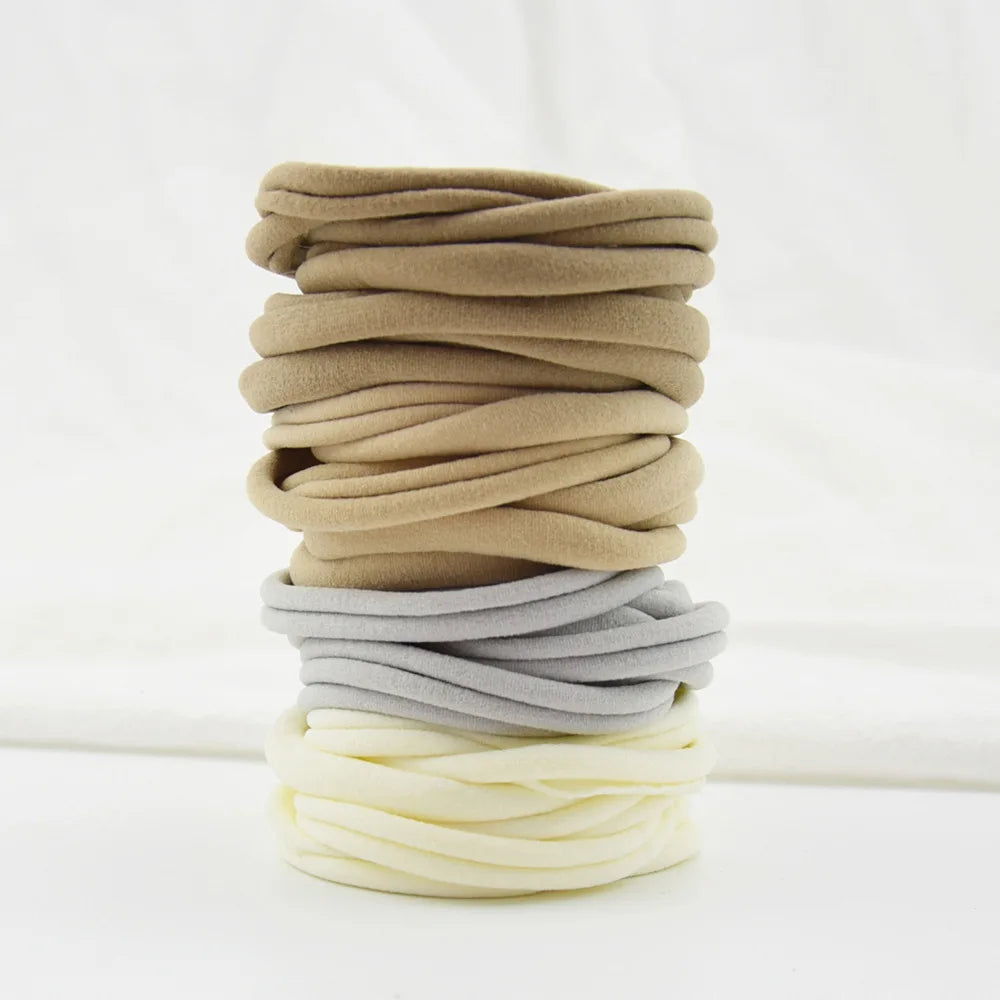Soft nylon headbands in cheerful colors, suitable for all baby girls