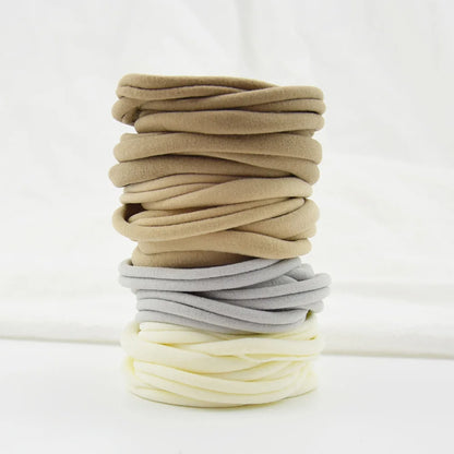 Soft nylon headbands in cheerful colors, suitable for all baby girls