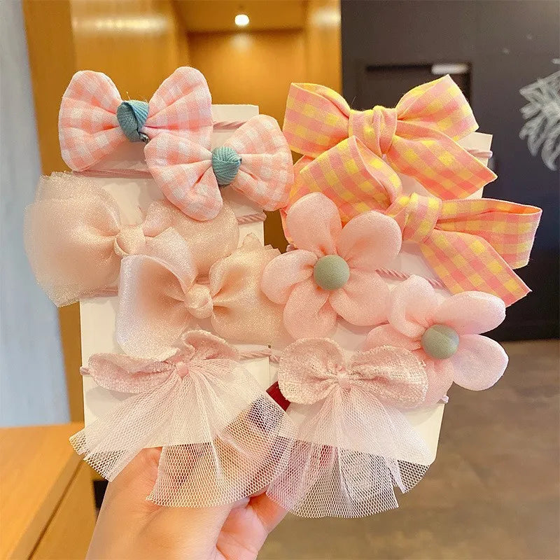 Soft nylon elastic headbands with flower bows, 10-pack for girls.