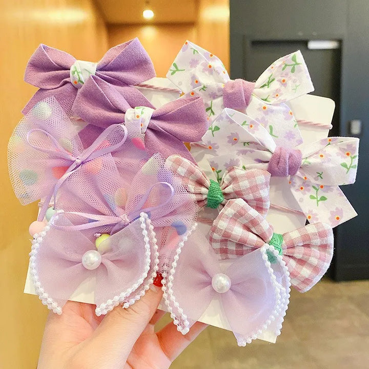 Versatile 10-pack soft flower bow headbands for girls. Everyday & party wear.