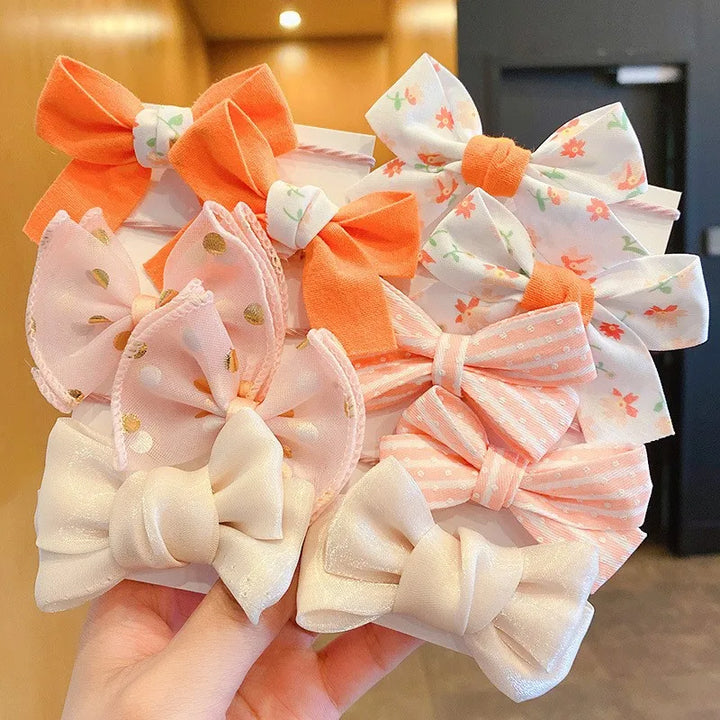 Cute flower bow hair accessories for girls. Soft nylon headbands, perfect everyday wear.